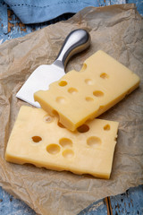 Two blocks of French emmental semi-hard cheese