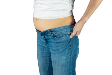 Fat woman in jeans isolated on white background.
