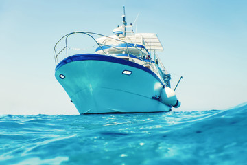 Motor boat floating clear turquoise water