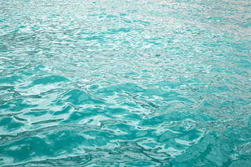 Deep ocean turquoise waters surface. amazing nature background ripple aqua texture.