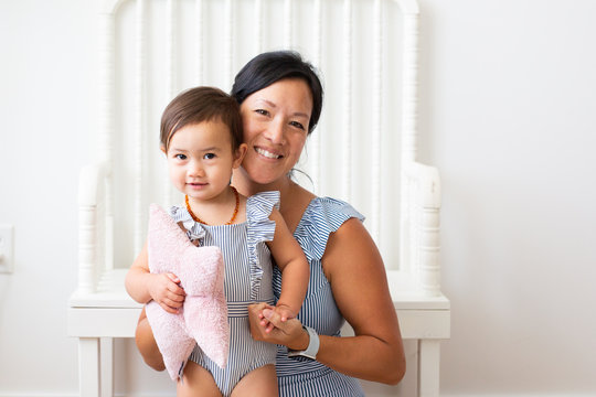 Mom And Baby Wearing Matching Outfits, Smiling Together, Baby Holding Stuffed Star Pillow