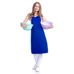 Woman in blue apron with kitchen bowl in hand on white background isolation