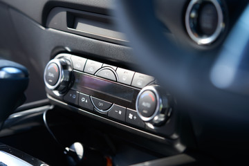 Plakat Vehicle interior of a modern car with air conditioner controller