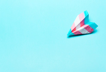 Paper airplane in transgender flag