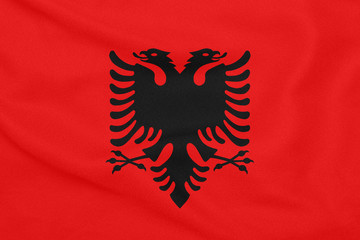 Flag of Albania on textured fabric. Patriotic symbol