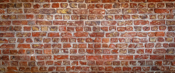 red brick wall texture grunge background with vignetted corners, may use to interior design