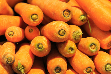 Group of well-arranged and placed carrots in market