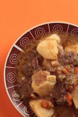 dish of stewed beef with potatoes and carrot