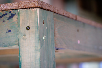 wooden construction with screwed metal angle bracket