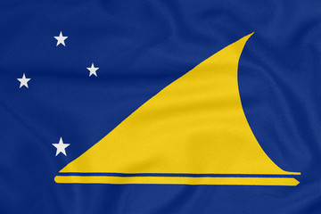 Flag of Tokelau on textured fabric. Patriotic symbol