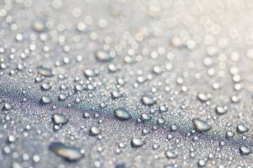 Background design made of water drops on a gray background