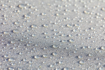 Background design made of water drops on a gray background