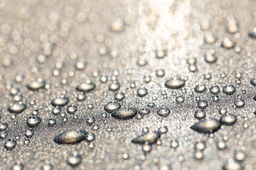 Background design made of water drops on a gray background