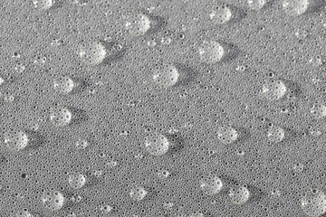 Background design made of water drops on a gray background