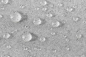 Background design made of water drops on a gray background