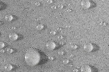 Background design made of water drops on a gray background
