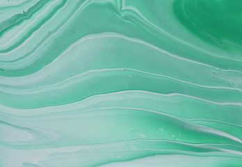 Fototapeta premium photography of abstract marbleized effect background. emerald, green, mint and white creative colors. Beautiful paint.