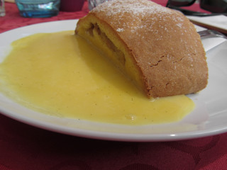 Delicious apple Strudel with vanilla cream . Alto Adige, Italy
