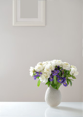 bouquet of white peonies and purple irises
