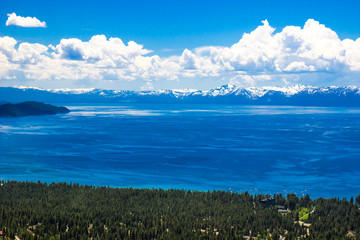 Lake Tahoe Shoreline & Snow Covered Mountains  In Springtime