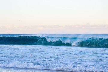 Beautiful sunset with ocean and waves