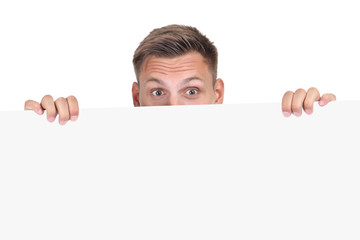 Young man with blank board on white background