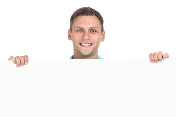 Young man with blank board on white background