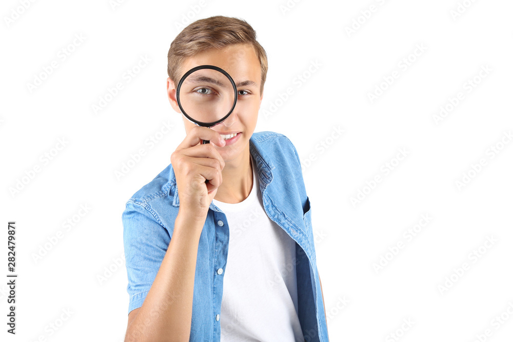 Canvas Prints Young man with magnifying glass on white background