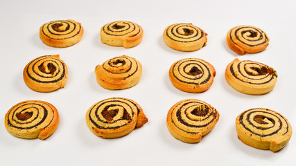 Obraz na płótnie Canvas Baked cookies with raisins and poppy seeds isolated on white background.