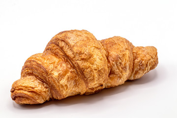 Fresh and tasty buttery croissants isolate on white background.