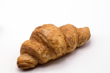 Fresh and tasty buttery croissants isolate on white background.
