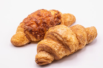 Fresh and tasty buttery croissants isolate on white background.