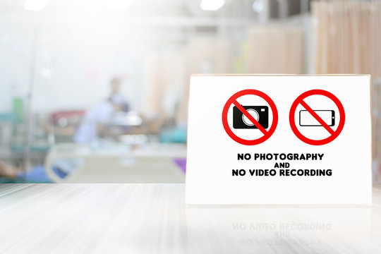 No photos and video allowed to take or recording pictures of the working station in the hospital on blurred background interior hospital doctors operation treatment with patient