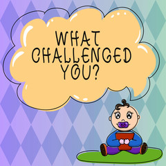 Fototapeta premium Text sign showing What Challenged You. Conceptual photo call someone to participate in competitive situation Baby Sitting on Rug with Pacifier Book and Blank Color Cloud Speech Bubble