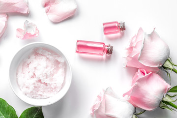 organic cosmetic with rose oil on white background top view