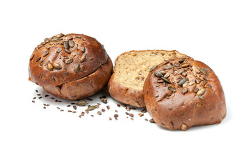 Sliced baked bread rolls with pumpkin seeds and sesame isolated on white background. Half sandwich bun with crisp.