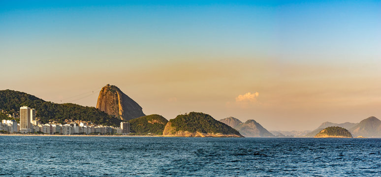 Panoramic image of Copacabana beach and Sugar Loaf in the background during late afternoon in Rio de Janeiro