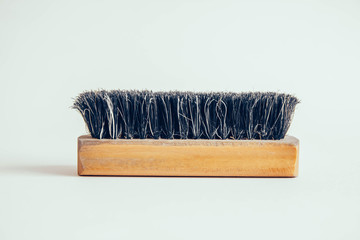 Wooden brush for clothes on a white background