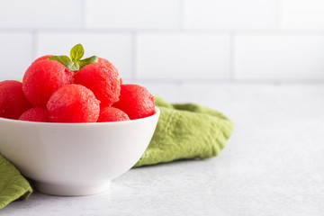 Watermelon Balls on a White Kitchen Cabinet