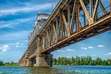 Old metal bridge across the Dnieper River in Eastern Europe, Ukraine	