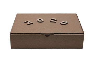 2020 numerals of the new year on the Cardboard brown closed rectangular box