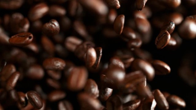 Super slow motion of flying coffee beans. Filmed on high speed cinema camera, 1000 fps.
