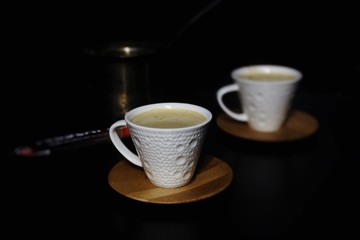 cup of coffee on wooden table