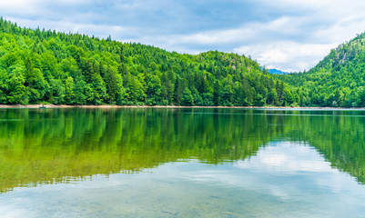 Fototapeta premium Nussensee lake in Upper Austria located near Bad Ischl in the Salzkammergut - wide panoramic view.