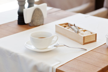 Cup coffee in park cafe. Modern design interior. Concept of vacation and leisure
