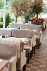 Table and chairs in park cafe. Modern design interior. Concept of vacation and leisure