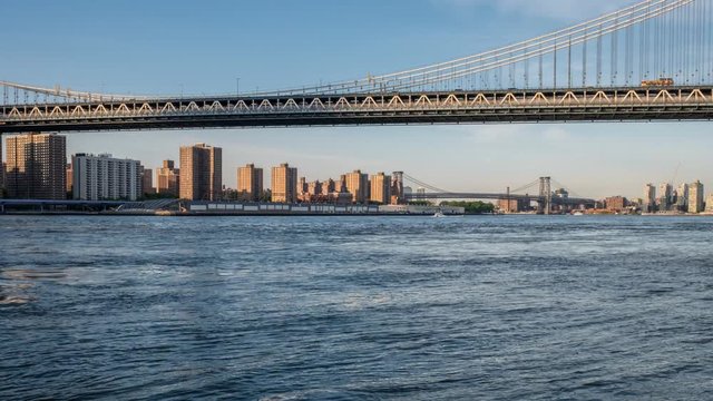 Time-lapse: View of the Brooklyn bridge during a dusk from East river. New York City