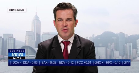 MS Male anchor reporting live from Hong Kong, China with stock market update
