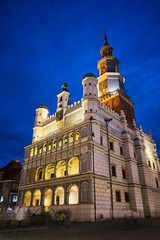 Renaissance town hall tower with clock  at night in Poznan.