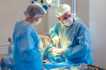 Medical Team Performing Surgical Operation in Modern Operating Room. Rhinoplasty